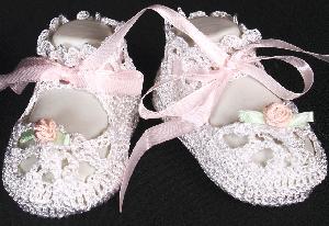 WHITE RAYON BOOTIE WITH TINY PINK ROSEBUD AND GREEN PETALS.   