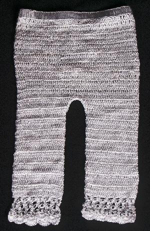 WHITE RAYON CAPRI BOTTOM WITH LACY EDGE.