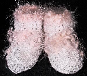 WHITE RAYON BOOTIE WITH PINK FUZZY TRIM.  