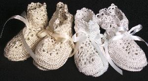 HIGH TOP RAYON BOOTIE EMBELLISHED WITH TINY SEED PEARLS.  AVAILABLE IN WHITE OR IVORY.  MATCHING PIECES; HAT, PACIFIER HOLDER.  SEE BELOW.