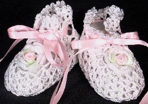 WHITE RAYON HIGH TOP BOOTIE WITH WHITE CROCHETED FLOWERS WITH PINK ROSEBUDS AND GREEN LEAVES.   