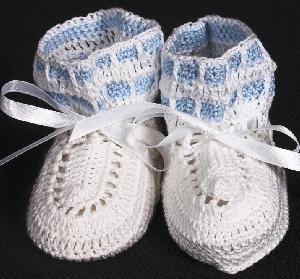 WHITE COTTON HIGH TOP BOOTIE WITH TWO STRIPES OF BLUE AROUND THE TOP EDGE.   