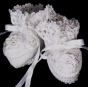 WHITE RAYON HIGH TOP BOOTIE WITH SMALL WHITE FLOWER ON TOE.
 
