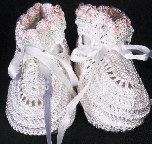 WHITE RAYON HIGH TOP BOOTIE WITH TINY PINK TULIPS WITH GREEN STEMS AROUND THE TOP.  