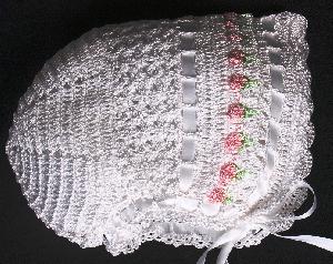 WHITE RAYON HAT WITH PINK EMBROIDERED FLOWERS WITH GREEN STEMS.   