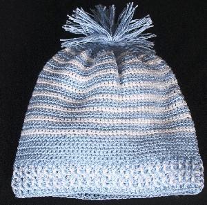 BLUE AND WHITE STRIPE COTTON HAT WITH TASSEL TOP.  