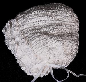 WHITE RAYON HAT WITH ROWS OF FRILLS.   