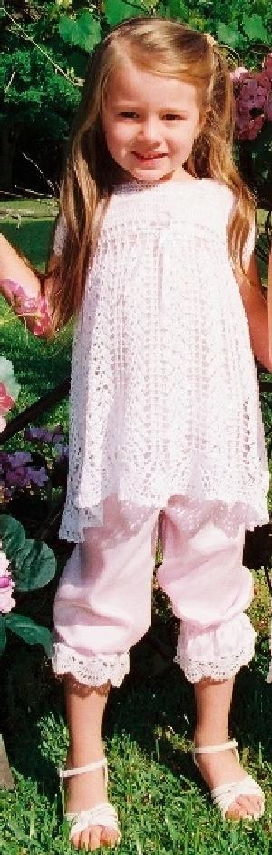 WHITE OR IVORY RAYON DRESS.  A FAVORITE BECAUSE OF THE LONG TERM WEARABILITY, JUST TIGHTEN THE RIBBONS AT THE SLEEVE, BODICE AND NECK, ADD PANTYLOONS FOR LARGER SIZES.  