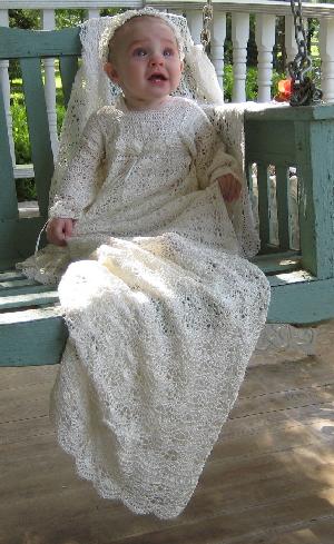 EUROPEAN LENGTH CHRISTENING GOWN AVAILABLE IN WHITE OR IVORY.  MATCHING PIECES; BOOTIES, HATS, BLANKETS.
