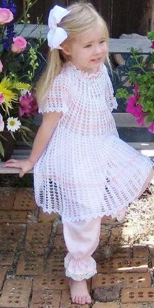 WHITE RAYON DRESS WITH PEACH STRIPES AND FLOWERS AROUND COLLAR.  
