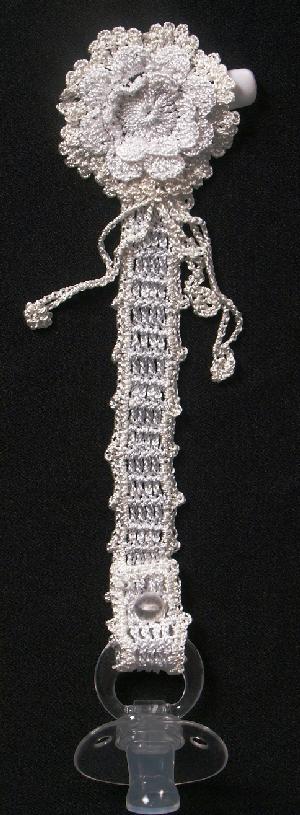 TWO TONE WHITE AND IVORY WITH TINY TASSELS, ONE OF OUR MOST ELEGANT PACIFIER HOLDERS.  