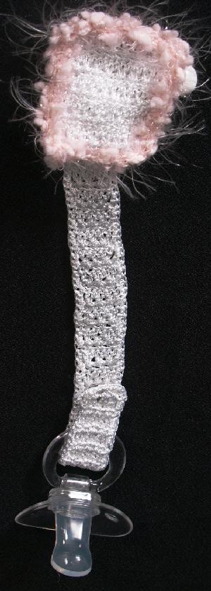 WHITE RAYON WITH PINK FUZZY TRIM.   