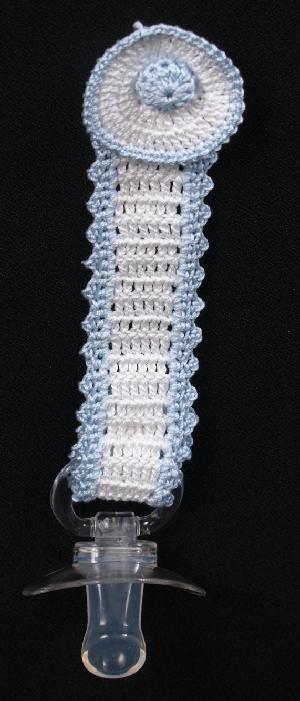WHITE COTTON WITH BLUE TRIMMED ROUND TOP WITH MINI BASEBALL IN THE CENTER.   