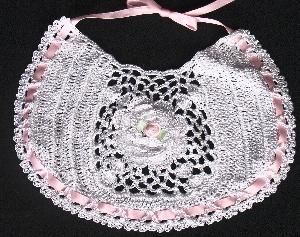 WHITE RAYON WITH PINK FLOWER AND TRIM.  