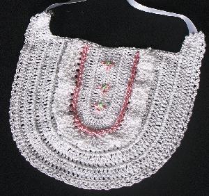 WHITE RRAYON WITH PINK RUFFLES AND TRIM.  PEARL BUTTON ACCENTS.   