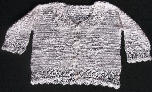 WHITE RAYON WITH DELICATE TRIM.   