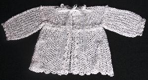WHITE RAYON, VERY ELEGANT.  WILL WORK BEAUTIFULLY OVER MANY OF OUR PIECES.