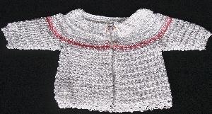 WHITE RAYON WITH PINK TINY FLOWER AND TRIM.   