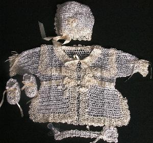 BEAUTIFUL VINTAGE TWO TONE WHITE AND IVORY SET INCLUDES; BOOTIES, HAT, PACIFIER HOLDER AND SWEATER.  ALSO ADD PANTYLOONS.