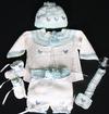 WHITE COTTON WITH BLUE AND GREEN TRIM AND LITTLE BLUE CHICS. SET INCLUDES BOOTIES, HAT, PACIFIER HOLDER, SHORTS AND SWEATER.