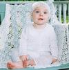 WHITE RAYON HAT, SWEATER AND CAPRI WITH LACY EDGING.