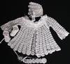 MOST DELICATE WHITE RAYON SET INCLUDES; BOOTIES, HAT, PACIFIER HOLDER AND SWEATER. COULD BE WORN WITH DIAPER COVER, CELESTE CAPRI OR PANTYLOON.