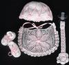 WHITE RAYON WITH PINK STAR AND TINY POM POM. SET INCLUDES BOOTIES, HAT, PACIFIER HOLDER, BIB.