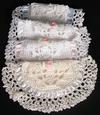 TREASURE POUCHES IN WHITE RAYON WITH DIFFERENT COLOR TRIM. POEM SAYS; PRETTY LITTLE CURLS AND TINY LITTLE TEETH, MANY BABY TREASURES FOR MOTHERS TO KEEP.