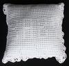 WHITE RAYON PILLOW IN FILET CROCHET WITH "BABY" SPELLED OUT.