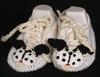WHITE COTTON BOOTIE WITH DOGGIE FACE AND TRIMMED IN BLACK & BROWN.