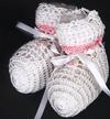 WHITE RAYON HIGH TOP BOOTIE WITH TEENY PINK AND GREEN FLOWER AND PINK STRIPE AROUND TOP.  ONE OF OUR LARGER BOOTIES.  