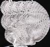 RAYON HAT IN WHITE OR IVORY, EMBELLISHED WITH CROCHET FLOWERS ON BOTH SIDES.   