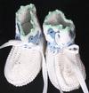 WHITE COTTON BOOTIE WITH GREEN AND BLUE TRIM AND LITTLE BLUE CHICS.   