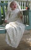 EUROPEAN LENGTH CHRISTENING GOWN AVAILABLE IN WHITE OR IVORY.  MATCHING PIECES; BOOTIES, HATS, BLANKETS.
