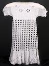 WHITE RAYON CROCHET WITH FILET CROCHET TRIM. AVAILABLE IN WHITE OR IVORY. THIS IS ANOTHER EXAMPLE OF ANTIQUE STYLE WITH RIBBON TO EXTEND THE LIFE OF THE GOWN. THIS COULD BE GATHERED UP AT BODICE, SLEEVES AND NECK FOR ACHRISTENING GOWN AND IS WORN HERE BY A SIZE 5. COULD ALSO ADD PANTYLOONS.
