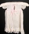 IVORY RAYON DRESS WITH LIGHT PINK RIBBON. VERY VINTAGE AND SIMPLE, BACK SHOWN. COULD BE WORN LONGER OVER PANTYLOONS OR JEANS.