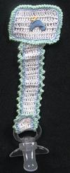 WHITE COTTON PACIFIER HOLDER WITH BLUE AND GREEN TRIM WITH LITTLE BLUE CHICS.   