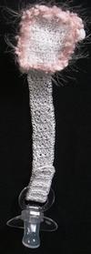 WHITE RAYON WITH PINK FUZZY TRIM.   