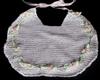 WHITE RAYON WITH TINY PINK DAISIES AND GREEN RIBBON TRIM.   