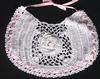 WHITE RAYON WITH PINK FLOWER AND TRIM.  