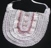 WHITE RRAYON WITH PINK RUFFLES AND TRIM.  PEARL BUTTON ACCENTS.   