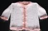WHITE RAYON WITH FUZZY PINK TRIM.  