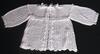 WHITE RAYON, VERY ELEGANT.  WILL WORK BEAUTIFULLY OVER MANY OF OUR PIECES.