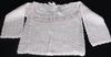 WHITE RAYON TULIP SWEATER HAS PINK TULIPS AROUND THE NECK.   